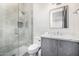 This bathroom features a modern glass shower with a rain shower head and a stylish vanity with a marble countertop at 9627 E Adobe Dr, Scottsdale, AZ 85255