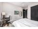Bedroom with desk and chair, and artwork on the walls at 9627 E Adobe Dr, Scottsdale, AZ 85255