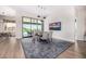 Dining room with hardwood floors, modern lighting, and picturesque views, perfect for Gathering meals at 9627 E Adobe Dr, Scottsdale, AZ 85255
