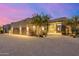 Stunning home featuring an extra long driveway with desert landscaping and a three-car garage at 9627 E Adobe Dr, Scottsdale, AZ 85255