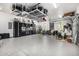 Spacious garage with epoxy flooring and storage racks to optimize organization and maximize usable area at 9627 E Adobe Dr, Scottsdale, AZ 85255