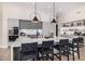 Modern kitchen featuring an oversized island with seating and high-end stainless steel appliances at 9627 E Adobe Dr, Scottsdale, AZ 85255