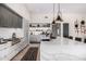Stylish kitchen featuring an island, sleek appliances, and open shelving at 9627 E Adobe Dr, Scottsdale, AZ 85255