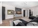 Relaxing living area features a TV, modern ceiling fan and dark colored doors at 9627 E Adobe Dr, Scottsdale, AZ 85255