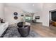 Open-concept living room with hardwood floors, modern decor, and seamless indoor-outdoor transition at 9627 E Adobe Dr, Scottsdale, AZ 85255