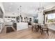 Open concept living space with chef's kitchen, dining area and living room with a view at 9627 E Adobe Dr, Scottsdale, AZ 85255