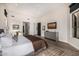 Bright main bedroom with vaulted ceiling, a serene color palette, and desert-inspired artwork at 9627 E Adobe Dr, Scottsdale, AZ 85255
