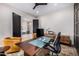 Office space with a large desk, comfortable chairs, and natural light streaming through the doorway at 9627 E Adobe Dr, Scottsdale, AZ 85255