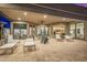 Covered patio with lounge chairs, a dining area, and outdoor lighting at 9627 E Adobe Dr, Scottsdale, AZ 85255