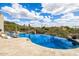 Luxury pool with waterfall features surrounded by desert landscaping creating a private outdoor oasis at 9627 E Adobe Dr, Scottsdale, AZ 85255