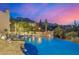 Backyard swimming pool with a waterfall feature and desert landscaping at 9627 E Adobe Dr, Scottsdale, AZ 85255