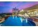 Relax by the beautiful pool area with a spa, lush greenery, and a covered patio, perfect for outdoor entertaining at 9627 E Adobe Dr, Scottsdale, AZ 85255