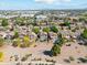 Residential area aerial view showcasing well-manicured lawns, private pools, and proximity to amenities at 991 W Leah Ln, Gilbert, AZ 85233