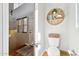Cozy powder room featuring a modern round shelf display and neutral tones at 991 W Leah Ln, Gilbert, AZ 85233