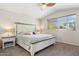 Comfortable bedroom boasts large bed, neutral tones, and bright natural light at 991 W Leah Ln, Gilbert, AZ 85233