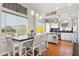 Charming dining area offering plentiful natural light and seamless flow to the kitchen and stainless steel appliances at 991 W Leah Ln, Gilbert, AZ 85233