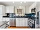 Well-appointed kitchen showcasing granite countertops, stainless steel appliances, and abundant cabinet space at 991 W Leah Ln, Gilbert, AZ 85233