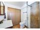Bathroom featuring a glass enclosed shower, a toilet, and a sink with cabinet storage at 111 S Greenfield Rd # 611, Mesa, AZ 85206