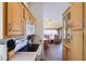 Efficient kitchen leading into a cozy living area with laminate flooring at 111 S Greenfield Rd # 611, Mesa, AZ 85206