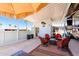 Relaxing covered RV patio featuring stylish outdoor furniture, privacy fencing, and a welcoming atmosphere at 111 S Greenfield Rd # 784, Mesa, AZ 85206