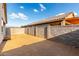 Enclosed backyard featuring a block wall surrounding a desert landscape, perfect for customization at 11505 W Boca Raton Rd, El Mirage, AZ 85335