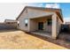 Exterior of home and covered patio with a fenced backyard at 11505 W Boca Raton Rd, El Mirage, AZ 85335