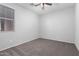 Neutral bedroom with carpet, a ceiling fan, and a window with blinds at 11505 W Boca Raton Rd, El Mirage, AZ 85335