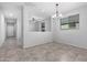 Inviting dining area with stylish chandelier lighting and ample natural light at 11505 W Boca Raton Rd, El Mirage, AZ 85335