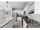 Bright kitchen features granite counters, stainless steel appliances and an island at 11505 W Boca Raton Rd, El Mirage, AZ 85335
