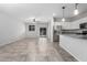 Bright living area with stainless steel appliances and easy access to the backyard at 11505 W Boca Raton Rd, El Mirage, AZ 85335