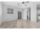 Open living space with neutral wall paint and seamless flow to the kitchen area at 11505 W Boca Raton Rd, El Mirage, AZ 85335