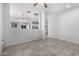 Bright open living space showcases modern tile flooring and neutral wall paint at 11505 W Boca Raton Rd, El Mirage, AZ 85335