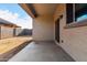 Covered back patio and view to a fenced backyard at 11505 W Boca Raton Rd, El Mirage, AZ 85335