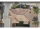 Aerial view of the house roof with a well-maintained yard and driveway, set in a neat neighborhood at 1317 N Balboa --, Mesa, AZ 85205