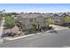 An aerial view shows the community, the sidewalks, the streets, the landscaping, and the desert yard at 1317 N Balboa --, Mesa, AZ 85205
