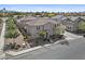 An aerial view shows the community, the sidewalks, the streets, the landscaping, and the desert yard at 1317 N Balboa --, Mesa, AZ 85205