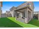 Backyard featuring green artificial turf, a covered patio, and privacy fencing at 1317 N Balboa --, Mesa, AZ 85205
