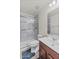 Modern bathroom with updated features, including a glass-enclosed shower, sleek vanity, and stylish flooring at 1317 N Balboa --, Mesa, AZ 85205