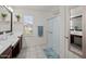 Well-lit bathroom with double vanity, shower, and modern fixtures at 1317 N Balboa --, Mesa, AZ 85205