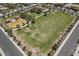 Aerial view of well-maintained community park with playground, pool, and green space at 1317 N Balboa --, Mesa, AZ 85205