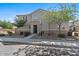 Charming two-story home with a well-maintained lawn and mature trees at 1317 N Balboa --, Mesa, AZ 85205