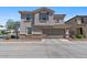 Charming two-story home featuring a symmetrical facade, desert landscaping, and a two car garage at 1317 N Balboa --, Mesa, AZ 85205