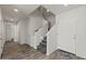 Inviting foyer with stairs, wood-look flooring, and neutral paint; access to other areas at 1317 N Balboa --, Mesa, AZ 85205
