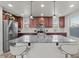 Bright kitchen with a large island, granite countertops, stainless steel appliances, and ample cabinet space for storage at 1317 N Balboa --, Mesa, AZ 85205