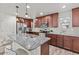 Spacious kitchen features granite countertops, dark cabinets, and stainless steel appliances, perfect for cooking and entertaining at 1317 N Balboa --, Mesa, AZ 85205