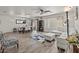 Open-concept living room with wood-look flooring, neutral decor, and ample natural light at 1317 N Balboa --, Mesa, AZ 85205