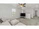 Comfortable upstairs loft with a white couch, large TV, and plenty of natural light at 1317 N Balboa --, Mesa, AZ 85205