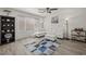 Comfortable living room with wood-look flooring, a white sectional, and a ceiling fan at 1317 N Balboa --, Mesa, AZ 85205