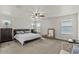Spacious main bedroom featuring carpet, ceiling fan, and natural lighting at 1317 N Balboa --, Mesa, AZ 85205