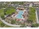 Aerial view of a community pool with lounge chairs and manicured landscaping creating a relaxing oasis for residents at 1317 N Balboa --, Mesa, AZ 85205